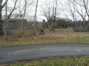 A volunteer tracks down some trash.